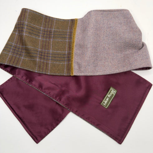 A folded men's neck warmer scarf with a brown and purple plaid pattern, a light purple herringbone side, and a deep burgundy satin lining.